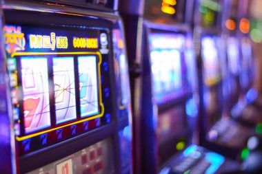 Mobile phone displaying live dealer casino tables and football betting interface